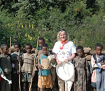 Meg with children in Ethiopia Church Forest